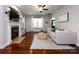 Open-concept living room with hardwood floors, a fireplace, and neutral decor provides a spacious feel at 12928 Windy Lea Ln, Huntersville, NC 28078