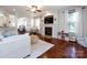 Inviting living room with a fireplace, ceiling fan, and hardwood floors for comfortable living at 12928 Windy Lea Ln, Huntersville, NC 28078