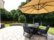 Patio with stone pavers and outdoor seating, creating a comfortable and inviting space to enjoy the outdoors at 12928 Windy Lea Ln, Huntersville, NC 28078
