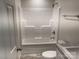 Bright bathroom featuring a shower and tub combination, updated fixtures, and neutral color palette at 130 Zircon Dr, Statesville, NC 28625
