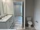 Bathroom with double sink vanity, modern toilet, and stylish finishes at 130 Zircon Dr, Statesville, NC 28625