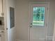 Entryway featuring a white door with glass, providing natural light and a view of the outdoors at 130 Zircon Dr, Statesville, NC 28625
