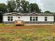 Charming single-story home with white siding and a welcoming front porch at 130 Zircon Dr, Statesville, NC 28625