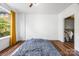 Bedroom with hardwood floors, natural light, and a walk-in closet at 1315 East Blvd, Charlotte, NC 28203
