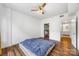 Bedroom features hard wood floors, a ceiling fan, and a walk-in closet at 1315 East Blvd, Charlotte, NC 28203