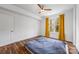 Bright bedroom boasts a ceiling fan, hardwood floors, and outside view at 1315 East Blvd, Charlotte, NC 28203