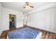 Bedroom boasts hardwood floors, a walk-in closet, and ample natural light at 1315 East Blvd, Charlotte, NC 28203