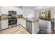 Modern kitchen featuring stainless steel appliances, granite countertops, and ample cabinet space at 1315 East Blvd, Charlotte, NC 28203