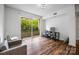 Inviting living room featuring sleek hardwood floors, modern furnishings, and a private balcony at 1315 East Blvd, Charlotte, NC 28203