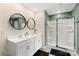 Contemporary bathroom with double vanity sinks, stylish mirrors, and glass-enclosed shower at 132 Sycamore Crossing Ct, Locust, NC 28097