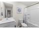 Bathroom with a shower/bathtub and white vanity, toilet, and wall decor at 132 Sycamore Crossing Ct, Locust, NC 28097