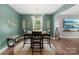 Chic dining room with modern lighting, providing a perfect setting for gatherings and everyday meals, hardwood floors at 132 Sycamore Crossing Ct, Locust, NC 28097