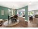 Open-concept dining and living room, offering a spacious and inviting layout for entertaining and relaxed living at 132 Sycamore Crossing Ct, Locust, NC 28097
