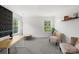 Bright home office featuring neutral paint, modern furniture and natural light from large windows at 132 Sycamore Crossing Ct, Locust, NC 28097