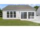A cozy patio and large windows brighten the backyard of this charming house at 1471 River Bend Blvd, Indian Land, SC 29707