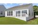 A green, grassy backyard with a patio extends from this house, perfect for outdoor enjoyment at 1471 River Bend Blvd, Indian Land, SC 29707
