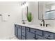 Modern bathroom with double vanity, marble countertops, and sleek black fixtures and hardware at 1471 River Bend Blvd, Indian Land, SC 29707