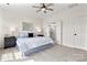Calm bedroom features queen bed, ceiling fan, and ensuite bathroom at 1471 River Bend Blvd, Indian Land, SC 29707