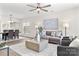 Open-concept living room with hardwood floors, lots of space, ceiling fan, and great natural lighting at 1471 River Bend Blvd, Indian Land, SC 29707