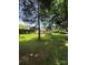 Picturesque backyard showcases a large grassy area, mature trees, and a lovely deck perfect for outdoor living at 1902 Stonewyck Ave, Kannapolis, NC 28081