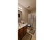 This bathroom has a shower/tub combo with a decorative shower curtain, vanity and neutral colors at 1902 Stonewyck Ave, Kannapolis, NC 28081