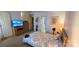 Well-lit bedroom showcases carpet floors, a ceiling fan, dresser, and queen bed at 1902 Stonewyck Ave, Kannapolis, NC 28081