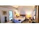 Bright primary bedroom with a queen bed, lamps and a doorway leading into an ensuite bath at 1902 Stonewyck Ave, Kannapolis, NC 28081