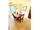 Elegant dining room featuring a chandelier, a wooden table with seating for four, and a bay window at 1902 Stonewyck Ave, Kannapolis, NC 28081