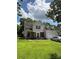 Inviting two-story home with manicured lawn, red front door, and attached garage, perfect for Gathering living at 1902 Stonewyck Ave, Kannapolis, NC 28081