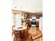 Eat-in kitchen featuring wood cabinets, modern appliances, and a cozy breakfast nook bathed in natural light at 1902 Stonewyck Ave, Kannapolis, NC 28081