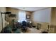This office features a large desk setup with a projector and screen for entertainment or professional presentations at 1902 Stonewyck Ave, Kannapolis, NC 28081