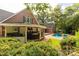 Expansive backyard with pool, patio, and outdoor kitchen, perfect for entertaining and relaxation at 1933 Tara Trl, Lancaster, SC 29720