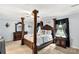 Inviting bedroom featuring a four-poster bed, wood furnishings, and soft color palette at 1933 Tara Trl, Lancaster, SC 29720
