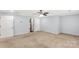 Large bedroom boasts neutral carpet, a ceiling fan, and closet storage space at 1933 Tara Trl, Lancaster, SC 29720