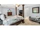 Comfortable bedroom with a four-poster bed, wood furnishings, and music decor for a creative touch at 1933 Tara Trl, Lancaster, SC 29720