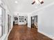 Inviting foyer with hardwood floors, elegant trim work, and a view of the staircase and living spaces at 1933 Tara Trl, Lancaster, SC 29720