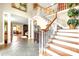 Grand foyer features an elegant staircase with hardwood and tiled floors at 1933 Tara Trl, Lancaster, SC 29720