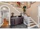 Elegant foyer featuring hardwood stairs, slate floors, and antique accents at 1933 Tara Trl, Lancaster, SC 29720
