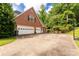 Spacious three-car garage and a basketball hoop, perfect for car enthusiasts and sports lovers alike at 1933 Tara Trl, Lancaster, SC 29720