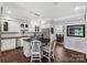 Bright kitchen with stainless steel appliances, island seating, and open access to the dining room at 1933 Tara Trl, Lancaster, SC 29720
