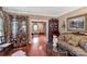 Charming living room boasting hardwood floors, elegant furnishings, and abundant natural light at 1933 Tara Trl, Lancaster, SC 29720