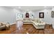 Spacious living room with hardwood floors and comfortable sectional seating at 1933 Tara Trl, Lancaster, SC 29720