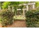 Playground framed by a decorative archway and lush greenery creates an inviting outdoor space at 1933 Tara Trl, Lancaster, SC 29720