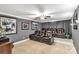 The theater room features multi-level seating, sconce lighting, and movie memorabilia at 1933 Tara Trl, Lancaster, SC 29720