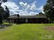 Lovely brick home featuring a classic design, a welcoming porch, and a sprawling green lawn at 208 Winter St, Richfield, NC 28137