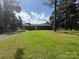 Charming one-story brick home with a well-manicured lawn and mature trees, perfect for suburban living at 208 Winter St, Richfield, NC 28137