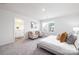 Carpeted primary bedroom with sitting area, natural light, and neutral tones at 219 Parker Claire Ln, Kings Mountain, NC 28086