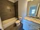 Stylish bathroom features a granite countertop, tiled shower, and modern fixtures at 219 Pine St, Rockwell, NC 28138