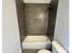 This bath features modern tile, a shower with a niche, and sleek fixtures at 219 Pine St, Rockwell, NC 28138