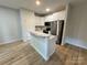 Modern kitchen featuring stainless steel appliances, white cabinets, and a breakfast bar at 219 Pine St, Rockwell, NC 28138